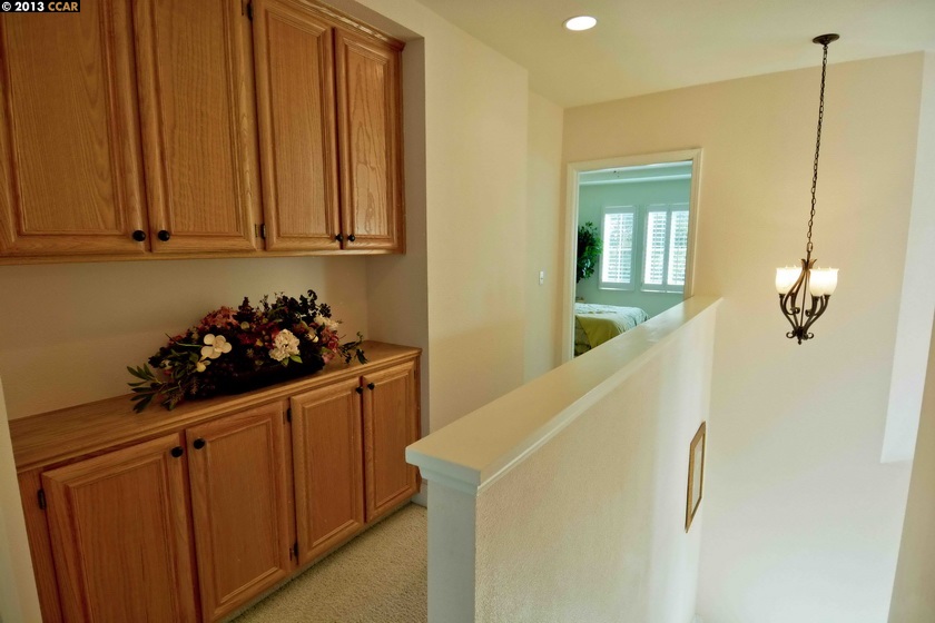 112 Coralflower Lane San Ramon, CA 94582 - Photo 10 of 21 a bathroom with a sink and cabinets