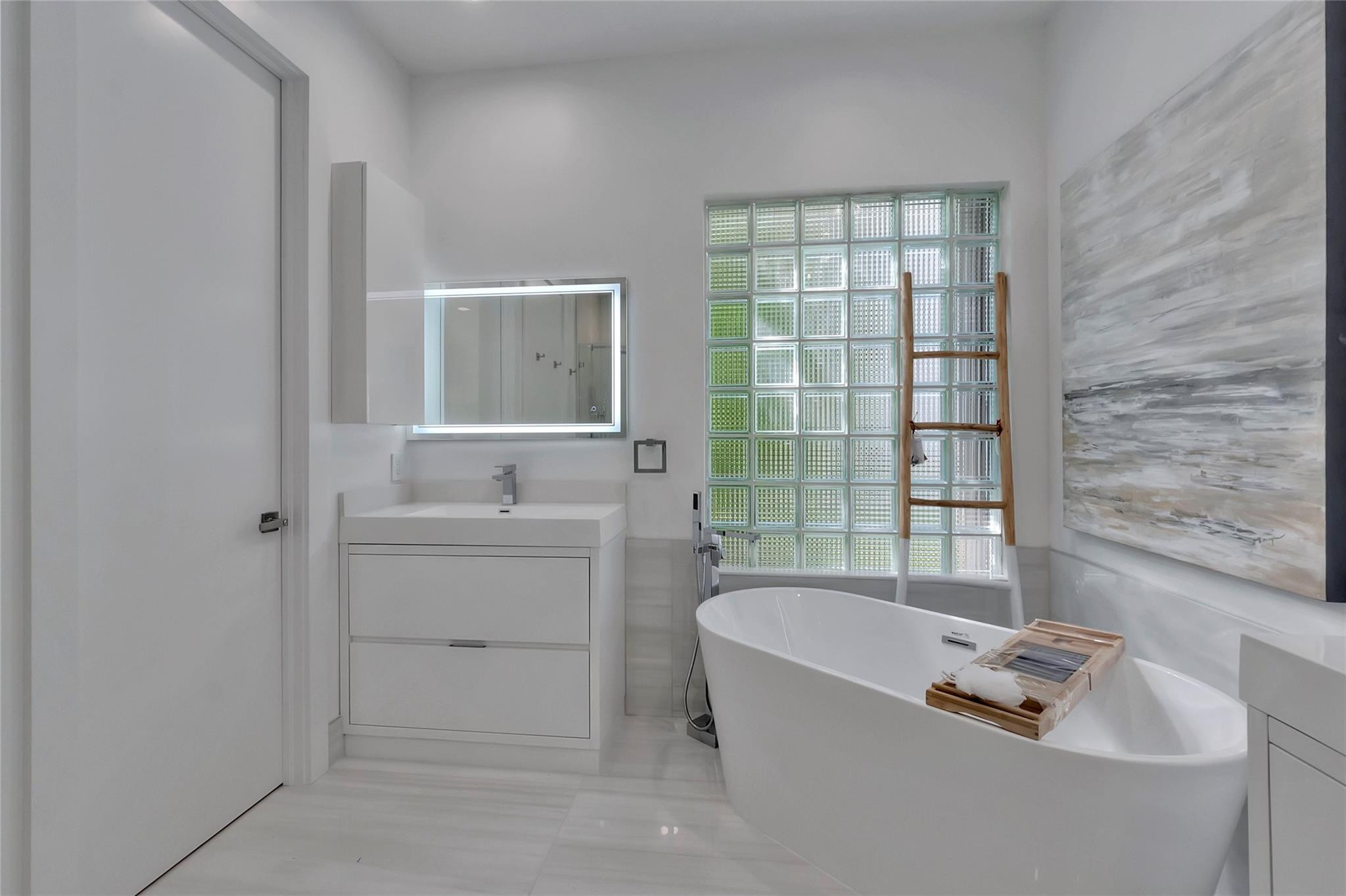 4088 Briarcliff Circle Boca Raton, FL 33496 - Photo 15 of 36 a bathroom with a bathtub and a sink