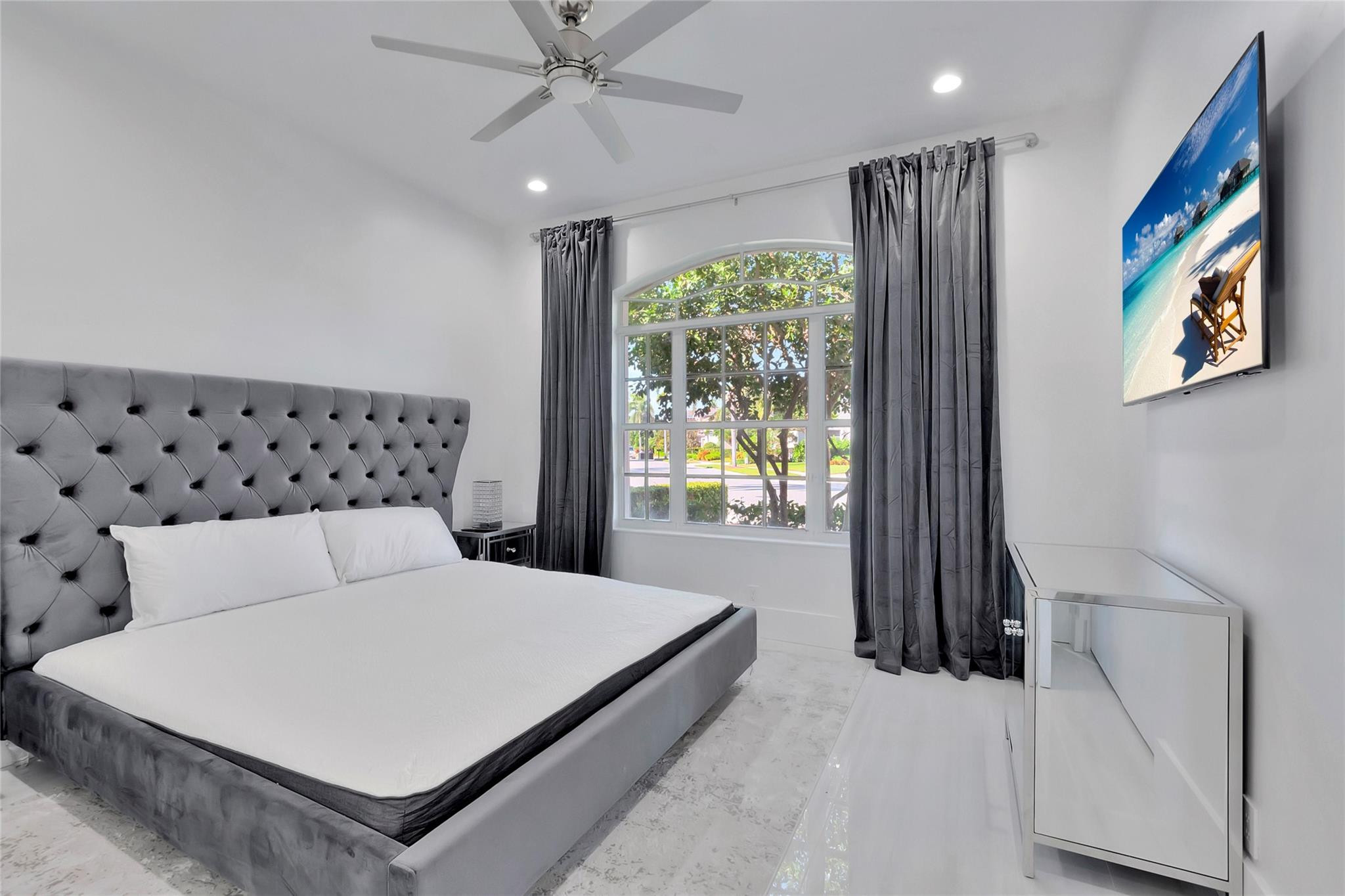 4088 Briarcliff Circle Boca Raton, FL 33496 - Photo 16 of 36 a bedroom with a large bed and a window