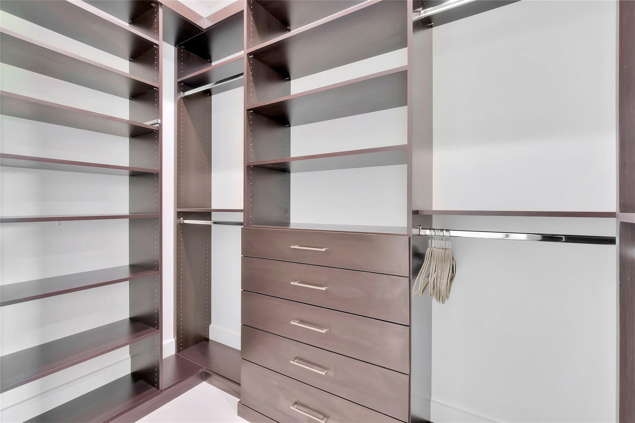 4088 Briarcliff Circle Boca Raton, FL 33496 - Photo 18 of 36 a view of walk in closet with empty racks