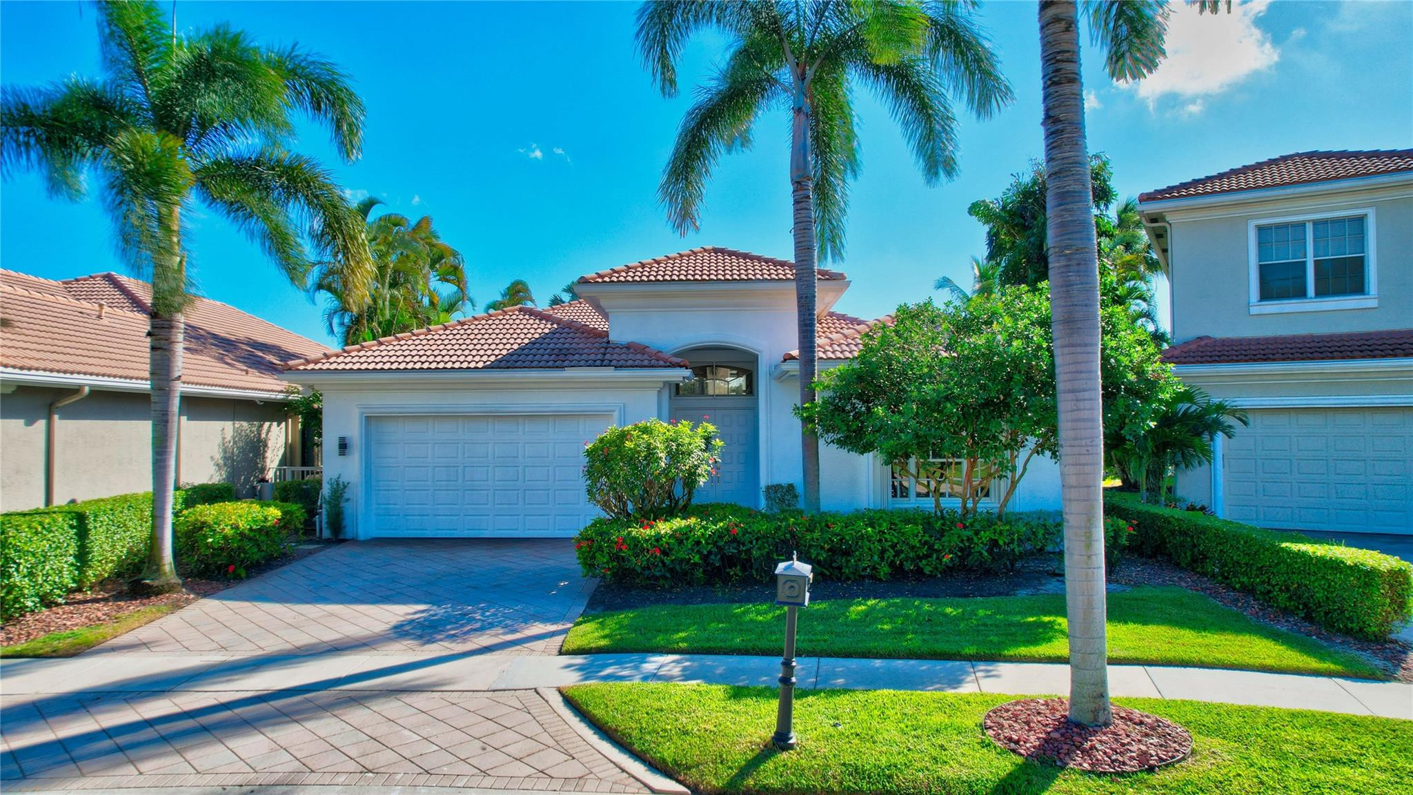 4088 Briarcliff Circle Boca Raton, FL 33496 - Photo 28 of 36 a front view of house with yard and green space