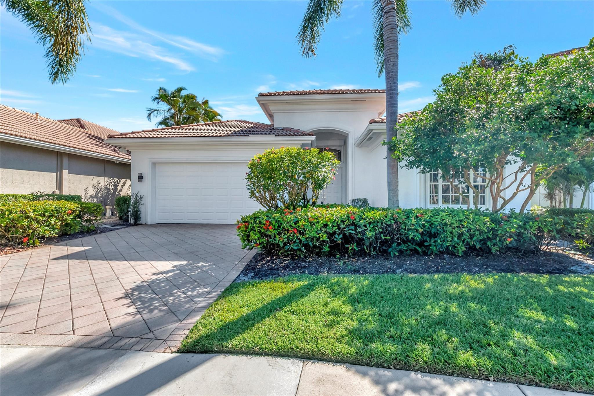 4088 Briarcliff Circle Boca Raton, FL 33496 - Photo 29 of 36 a front view of a house with a yard