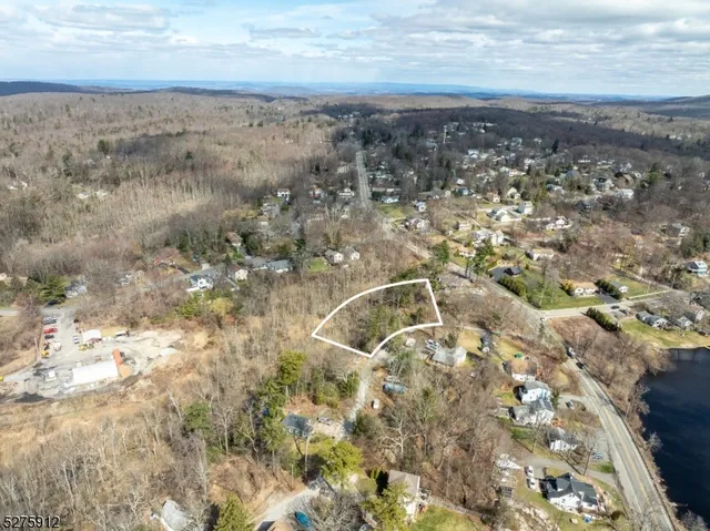 a aerial view of a house with a yard