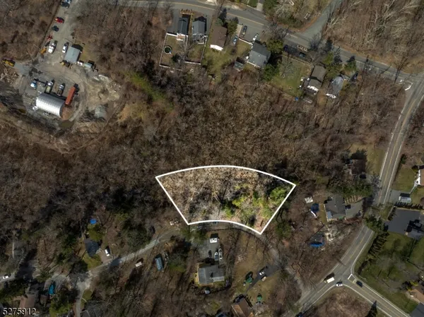 a aerial view of a house with a yard