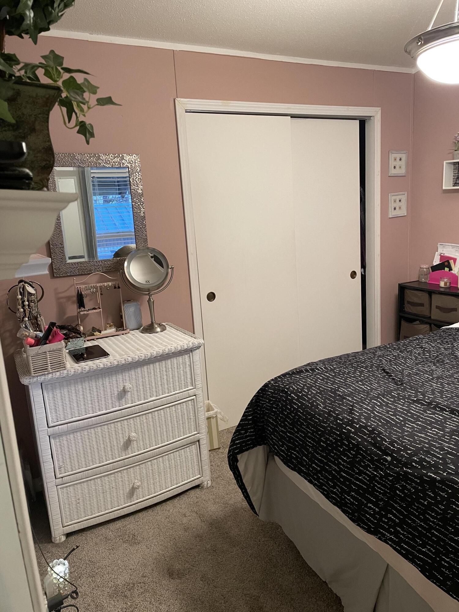 60901 Brosterhous Road, Unit 737 Bend, OR 97702 - Photo 16 of 17 a bedroom with a bed and a dresser