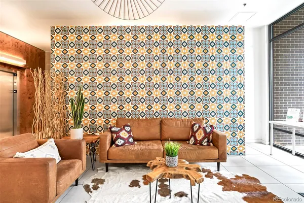 a living room with furniture and a rug