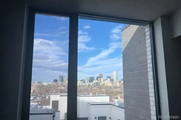 a view of a glass door with a view of the balcony