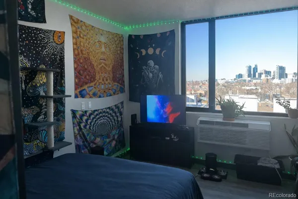 a bed sitting in a room next to a window