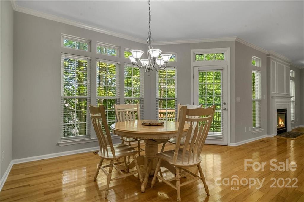500 Haley Court Fort Mill, SC 29708 - Photo 7 of 20 a dining room with furniture a chandelier and wooden floor