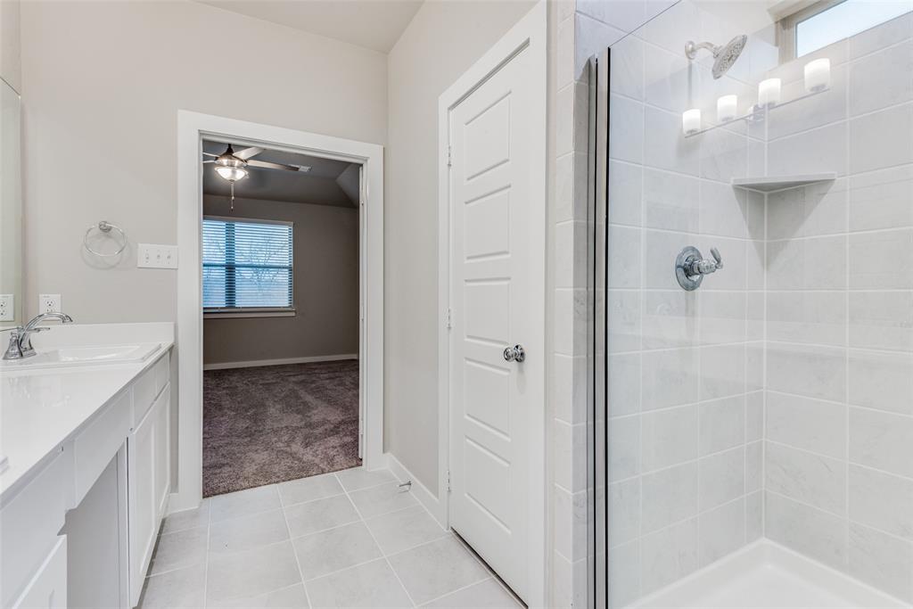 2544 Rambling Road Celina, TX 75009 - Photo 22 of 25 Bathroom with vanity, ceiling fan, tile floors, and a shower with door