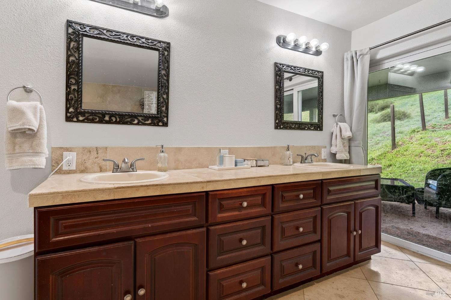17437 Greenridge Road Hidden Valley Lake, CA 95467 - Photo 11 of 54 a bathroom with a granite countertop sink and a mirror