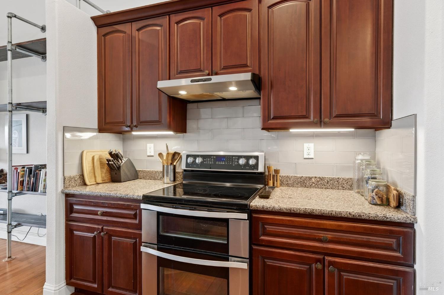 17437 Greenridge Road Hidden Valley Lake, CA 95467 - Photo 30 of 54 a kitchen with wooden cabinets and a stove top oven