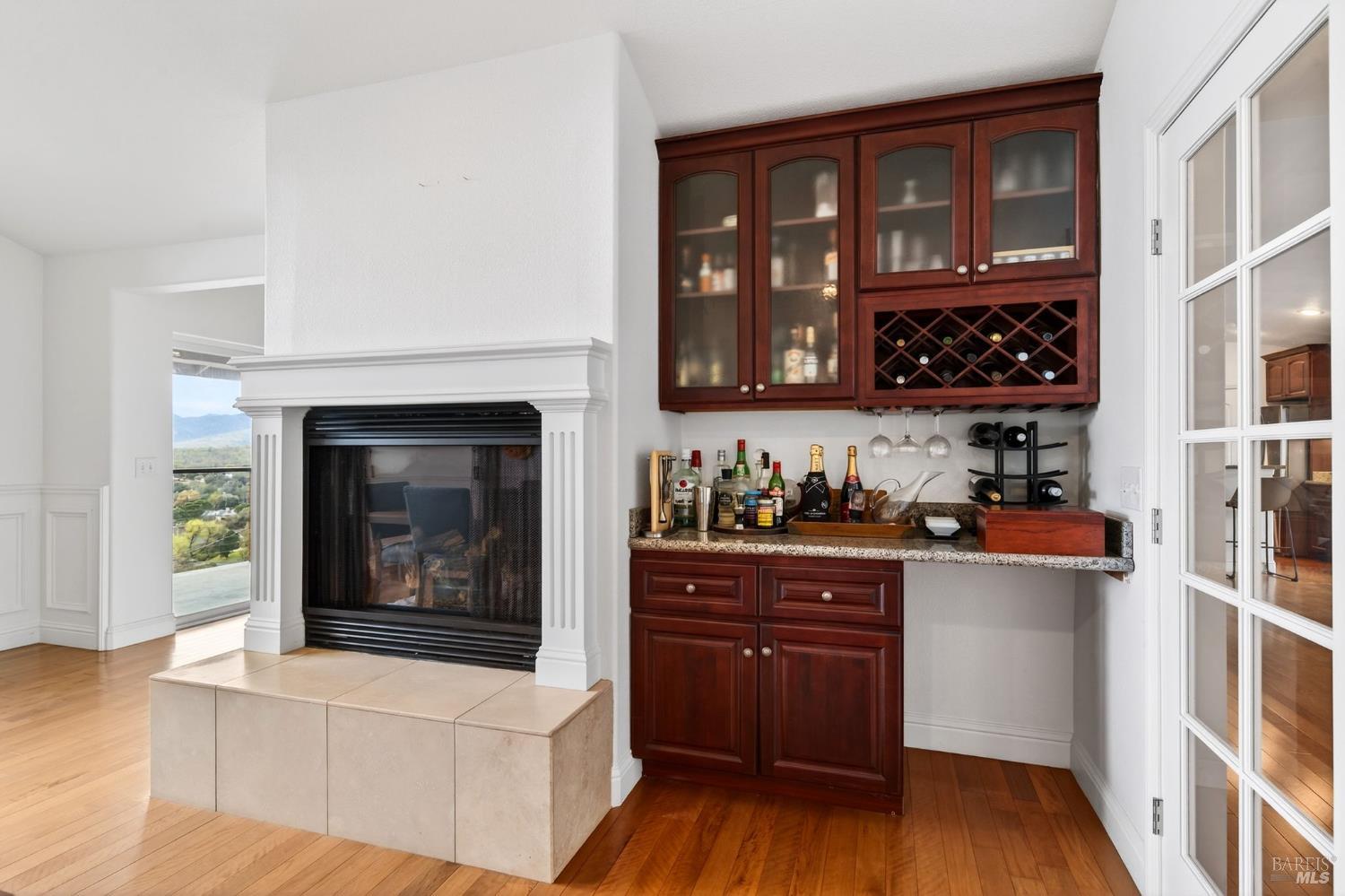 17437 Greenridge Road Hidden Valley Lake, CA 95467 - Photo 35 of 54 a kitchen with a wooden floor and a fireplace