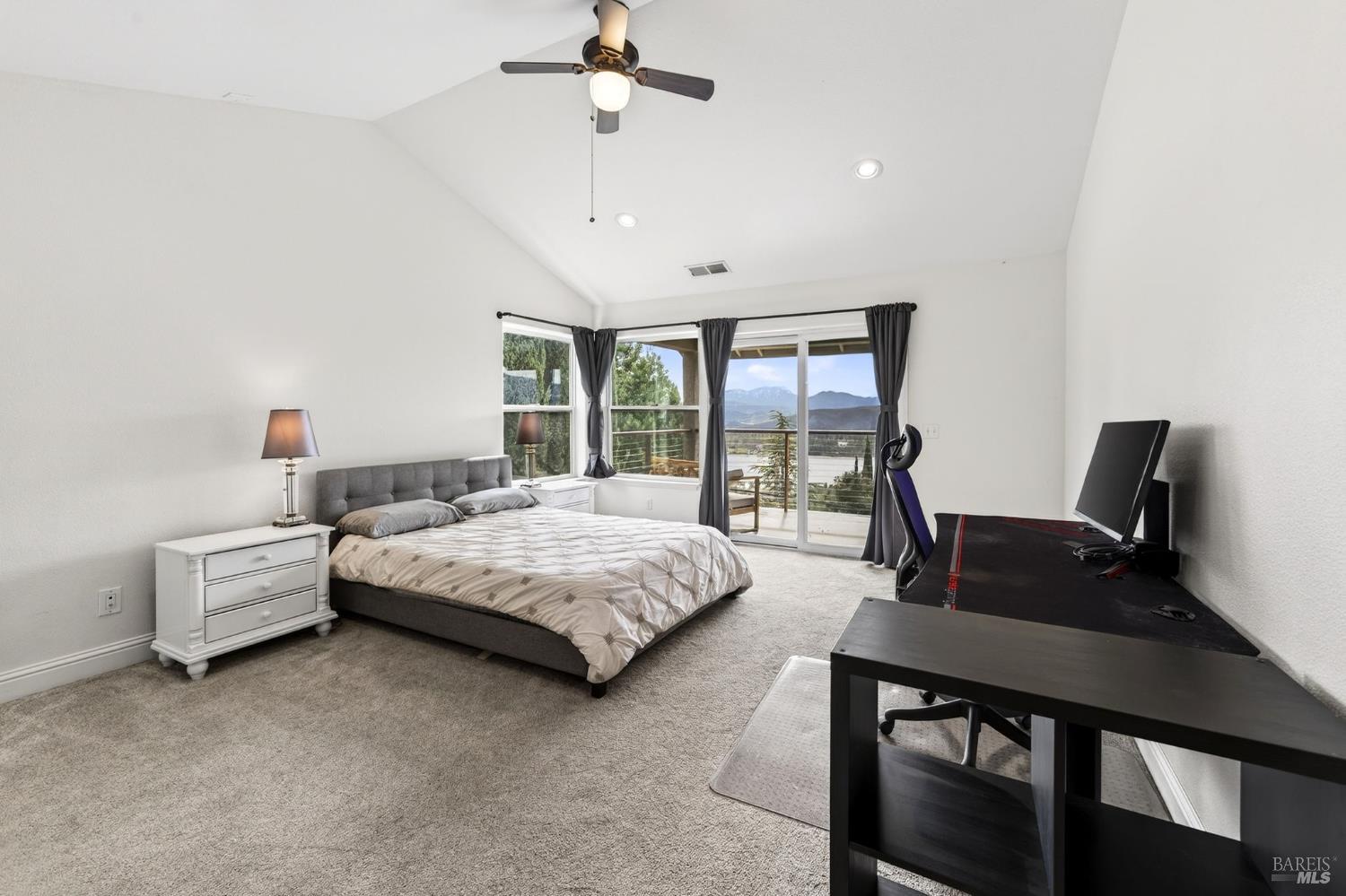 17437 Greenridge Road Hidden Valley Lake, CA 95467 - Photo 36 of 54 a spacious bedroom with a bed window and a desk
