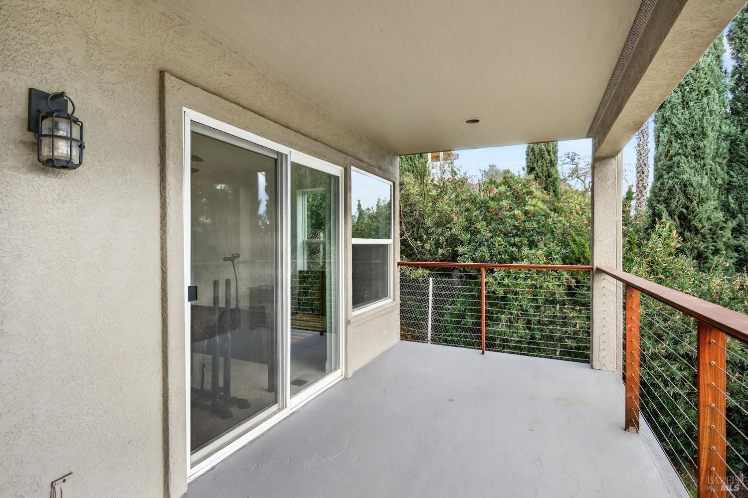 17437 Greenridge Road Hidden Valley Lake, CA 95467 - Photo 48 of 54 a view of balcony with floor to ceiling window and potted plants