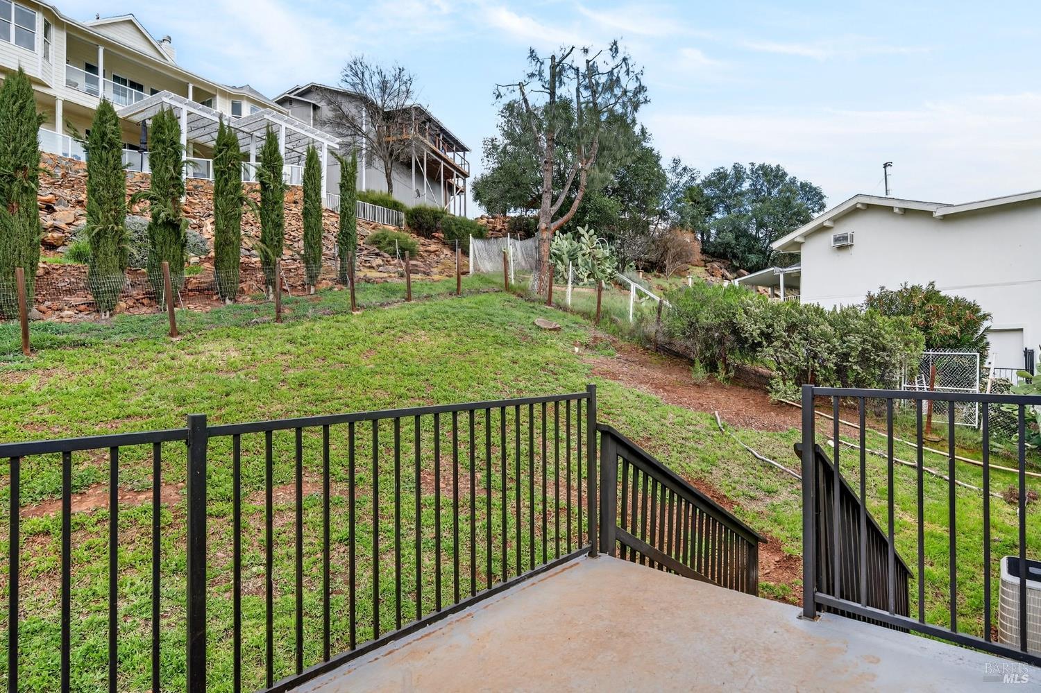 17437 Greenridge Road Hidden Valley Lake, CA 95467 - Photo 49 of 54 a view of a brick house in front of a yard with plants