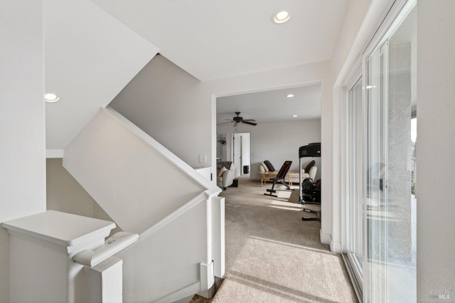 17437 Greenridge Road Hidden Valley Lake, CA 95467 - Photo 5 of 54 a view of a living room with white walls and stairs