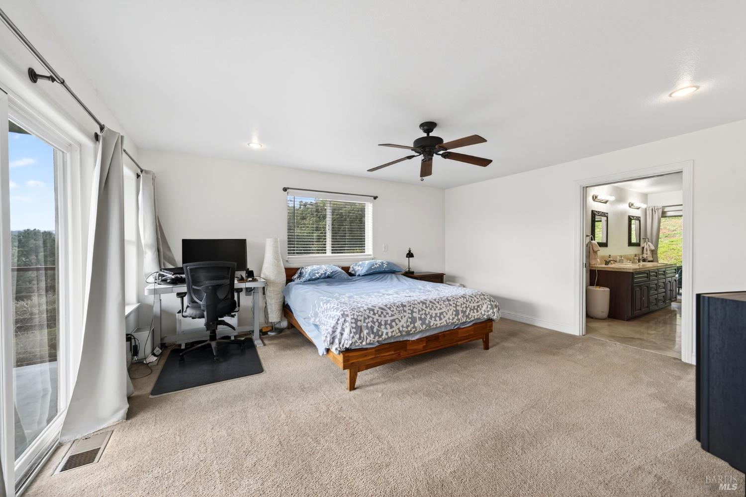 17437 Greenridge Road Hidden Valley Lake, CA 95467 - Photo 6 of 54 a bedroom with a bed and furniture