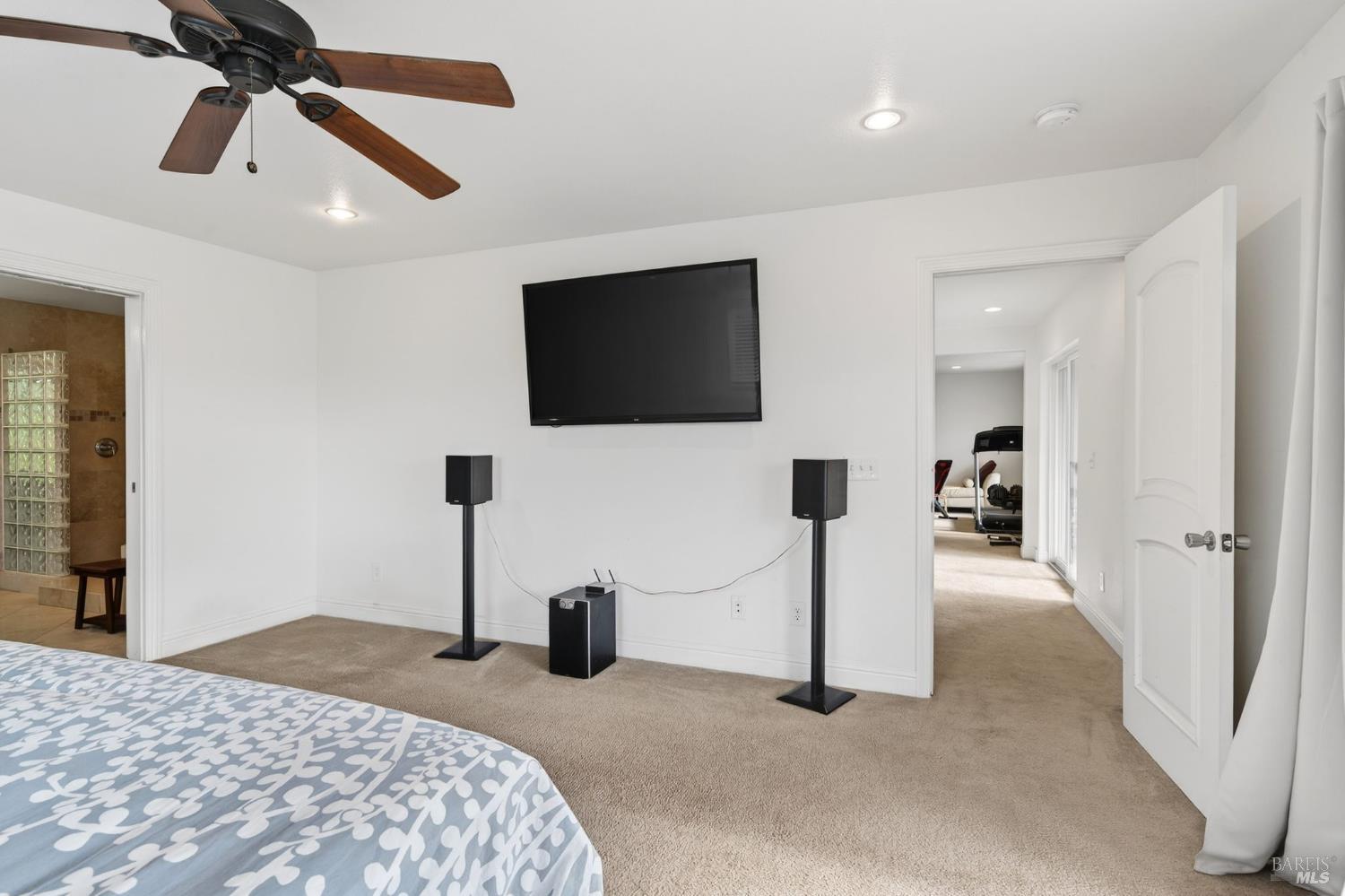 17437 Greenridge Road Hidden Valley Lake, CA 95467 - Photo 8 of 54 a bedroom with a bed and a flat screen tv