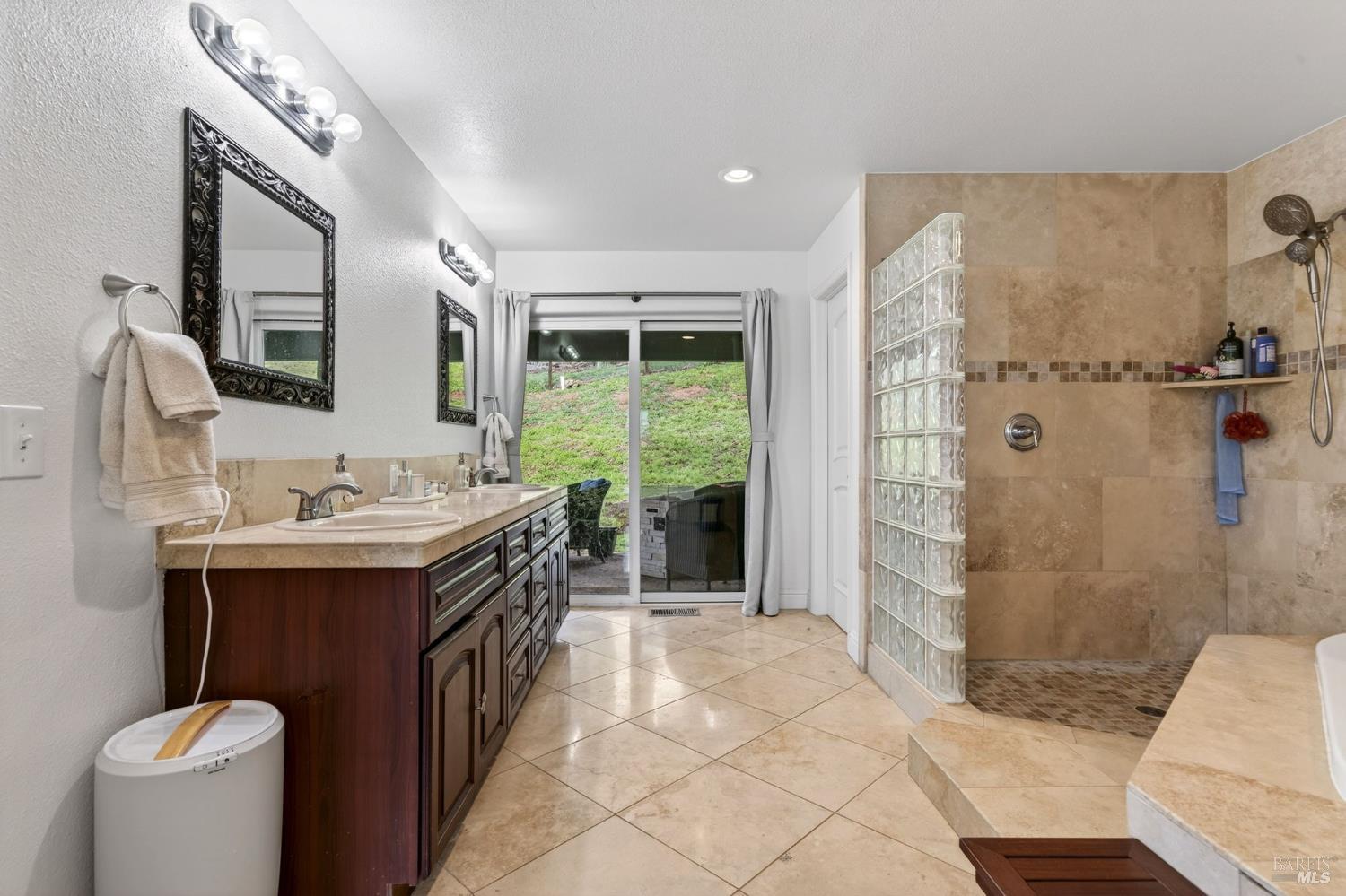 17437 Greenridge Road Hidden Valley Lake, CA 95467 - Photo 9 of 54 a spacious bathroom with a sink a mirror and a shower