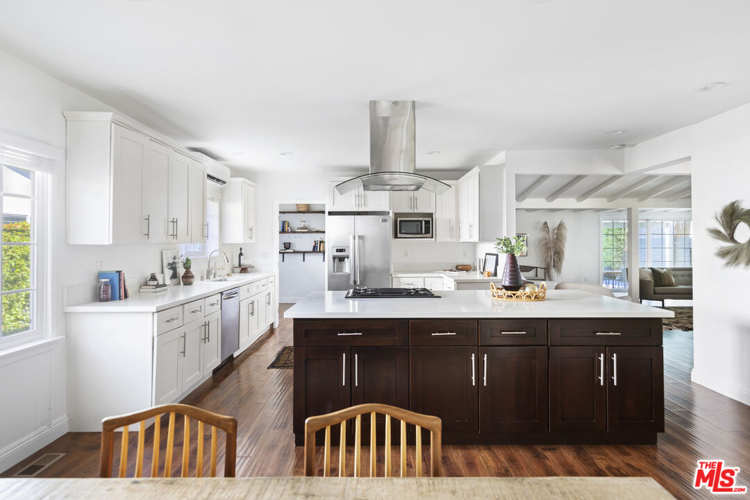 13604 Hart Street Van Nuys, CA 91405 - Photo 14 of 43 a kitchen with cabinets a sink and appliances