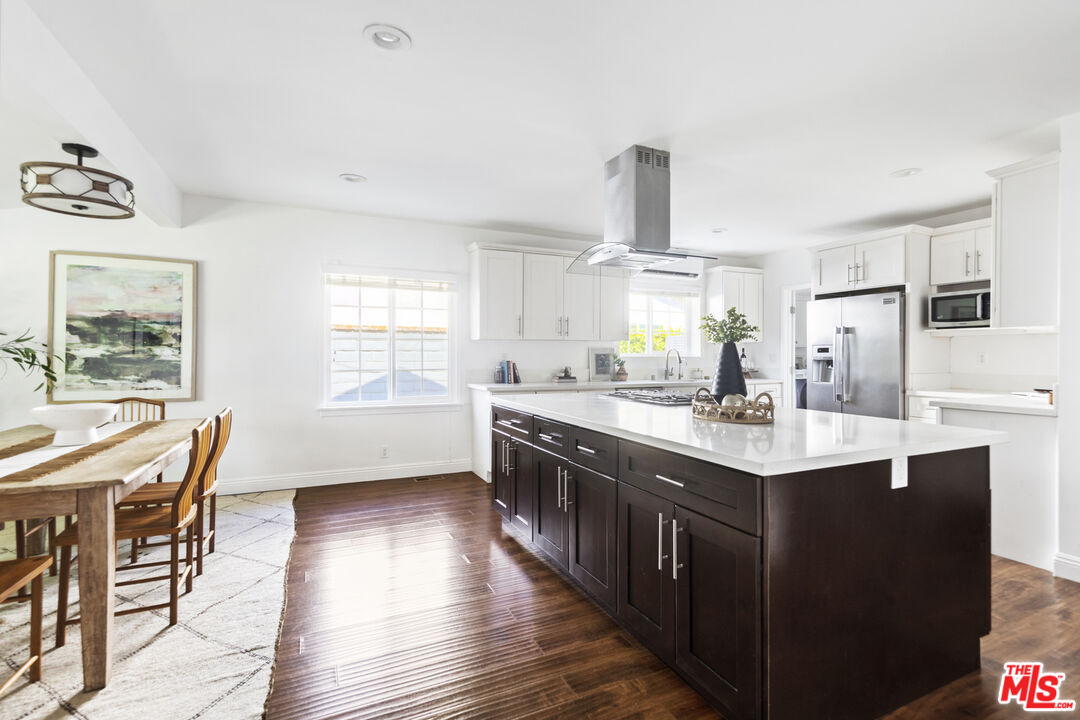 13604 Hart Street Van Nuys, CA 91405 - Photo 15 of 43 a kitchen with granite countertop a sink appliances counter top space and furniture