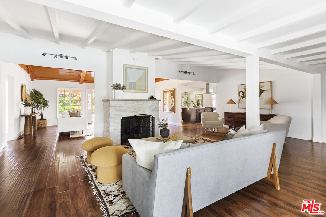 13604 Hart Street Van Nuys, CA 91405 - Photo 18 of 43 a living room with furniture a fireplace and wooden floor