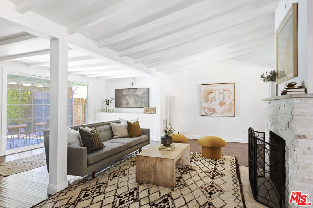 13604 Hart Street Van Nuys, CA 91405 - Photo 19 of 43 a living room with furniture and a fireplace