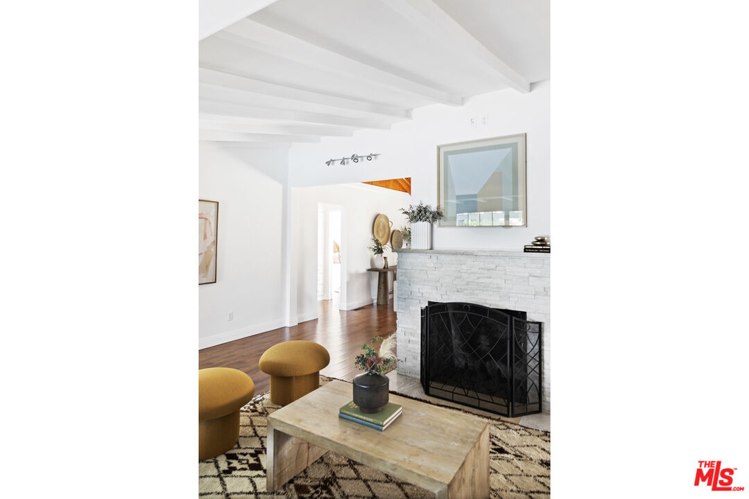 13604 Hart Street Van Nuys, CA 91405 - Photo 20 of 43 a living room with furniture and a fireplace