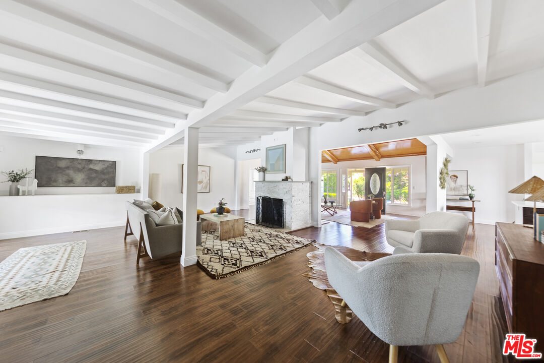 13604 Hart Street Van Nuys, CA 91405 - Photo 21 of 43 a living room with fireplace furniture and a wooden floor