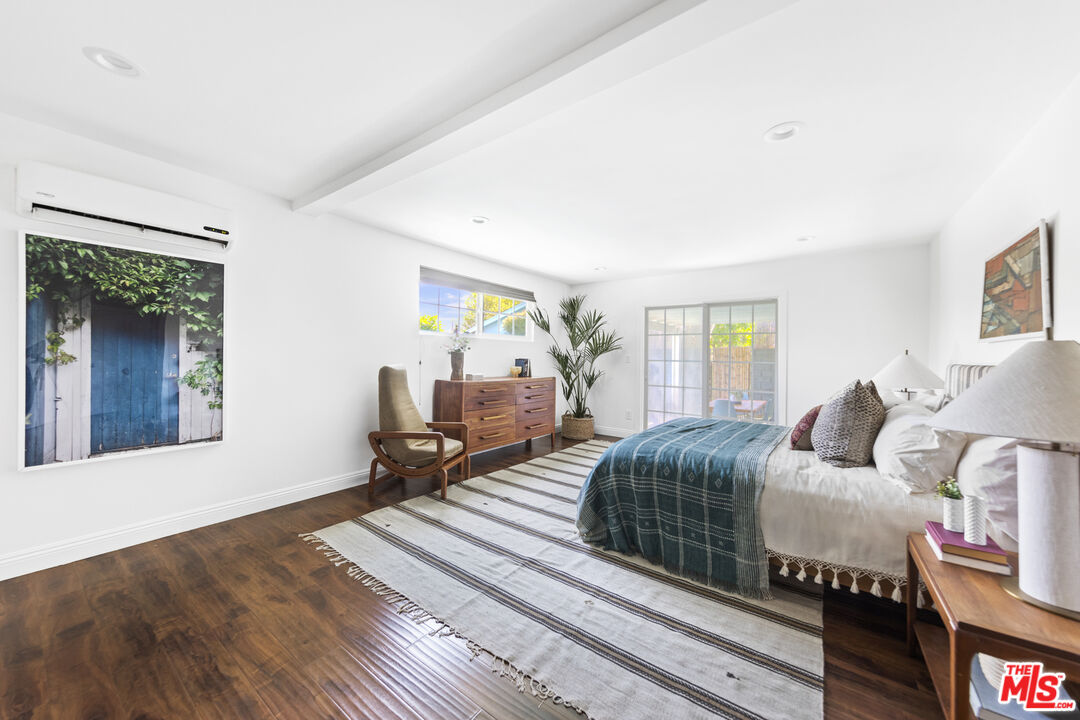 13604 Hart Street Van Nuys, CA 91405 - Photo 23 of 43 a bedroom with bed and wooden floor