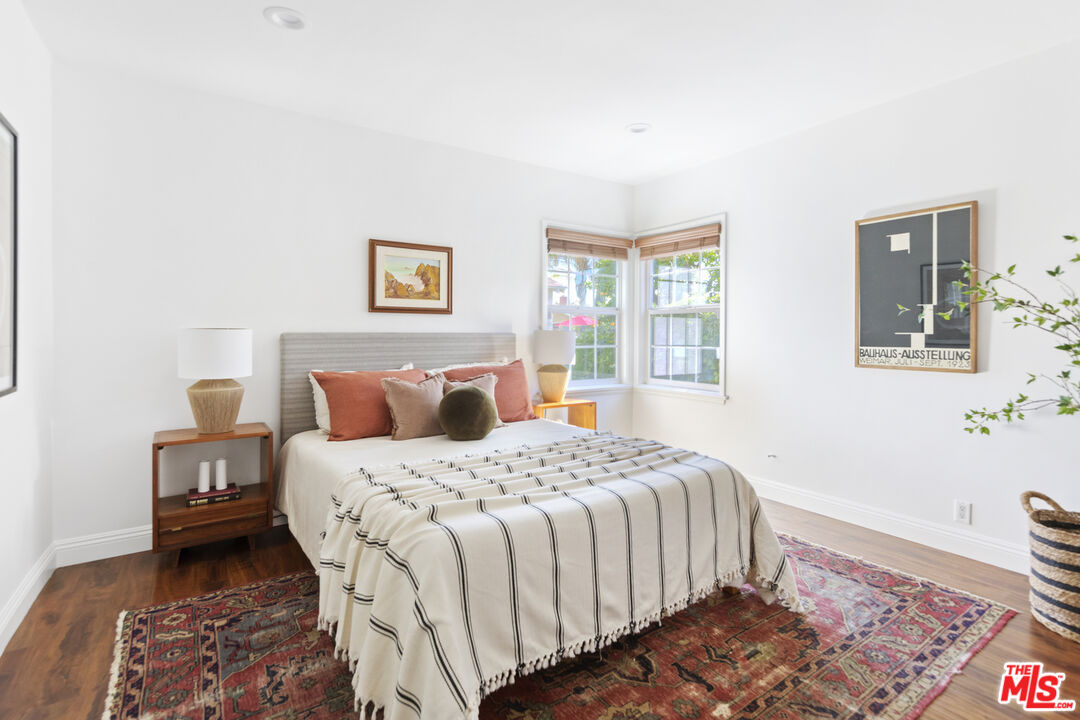 13604 Hart Street Van Nuys, CA 91405 - Photo 26 of 43 a bedroom with a bed and wooden floor