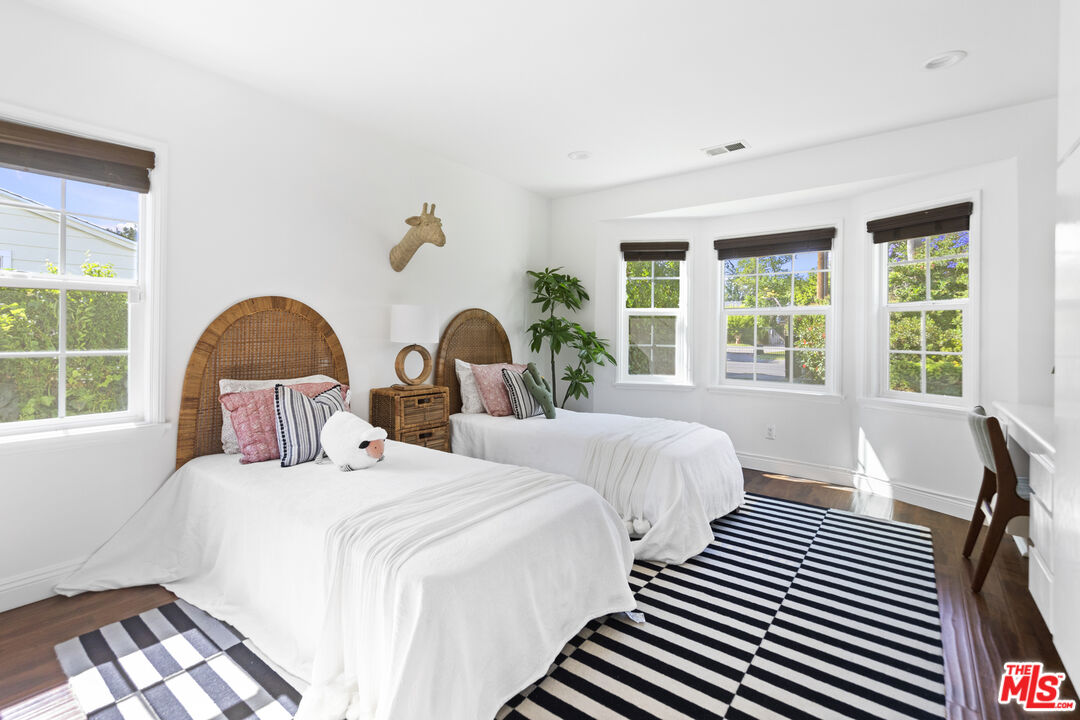 13604 Hart Street Van Nuys, CA 91405 - Photo 29 of 43 a bedroom with two beds and a large window