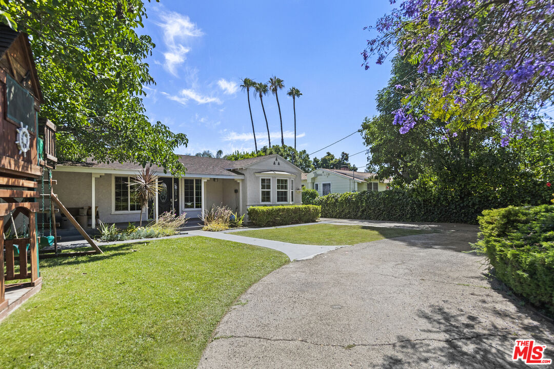 13604 Hart Street Van Nuys, CA 91405 - Photo 3 of 43 a view of a house with a yard and sitting area