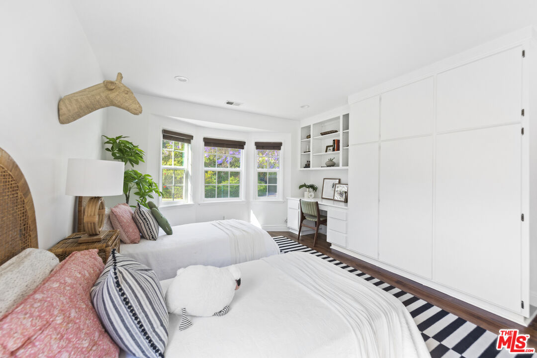 13604 Hart Street Van Nuys, CA 91405 - Photo 31 of 43 a bedroom with a large bed and a window