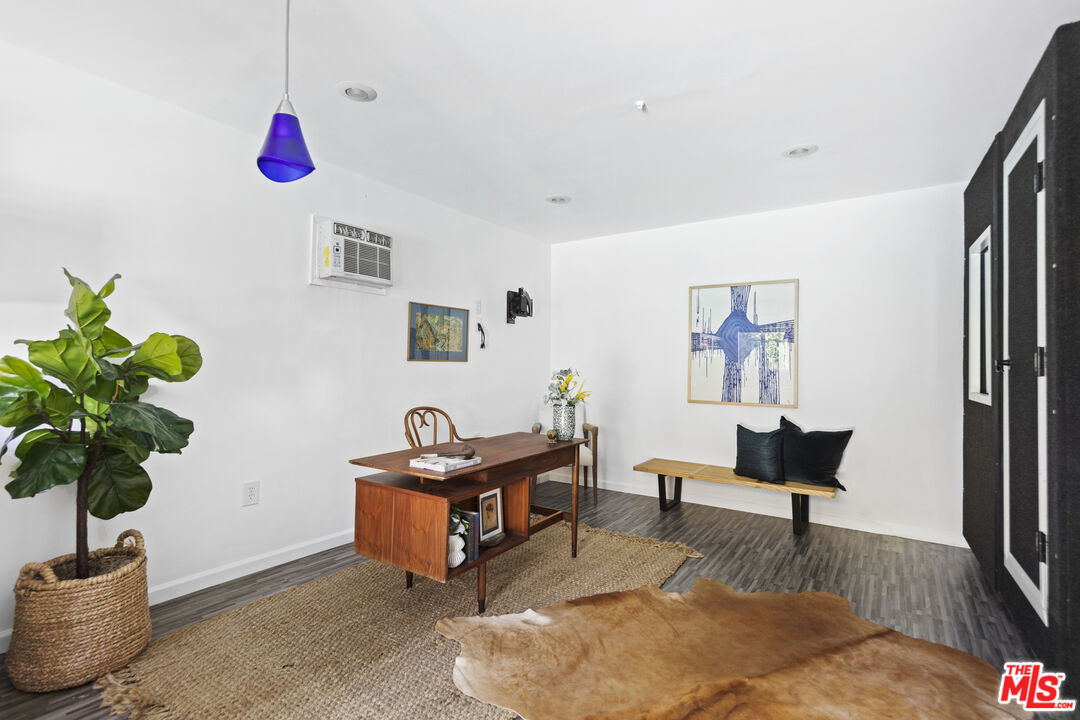 13604 Hart Street Van Nuys, CA 91405 - Photo 35 of 43 a living room with furniture and a potted plant