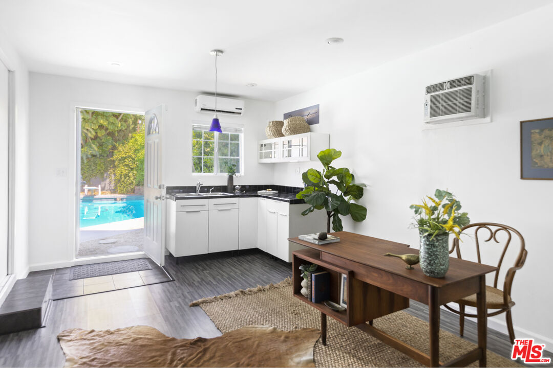 13604 Hart Street Van Nuys, CA 91405 - Photo 36 of 43 a living room with furniture and a potted plant