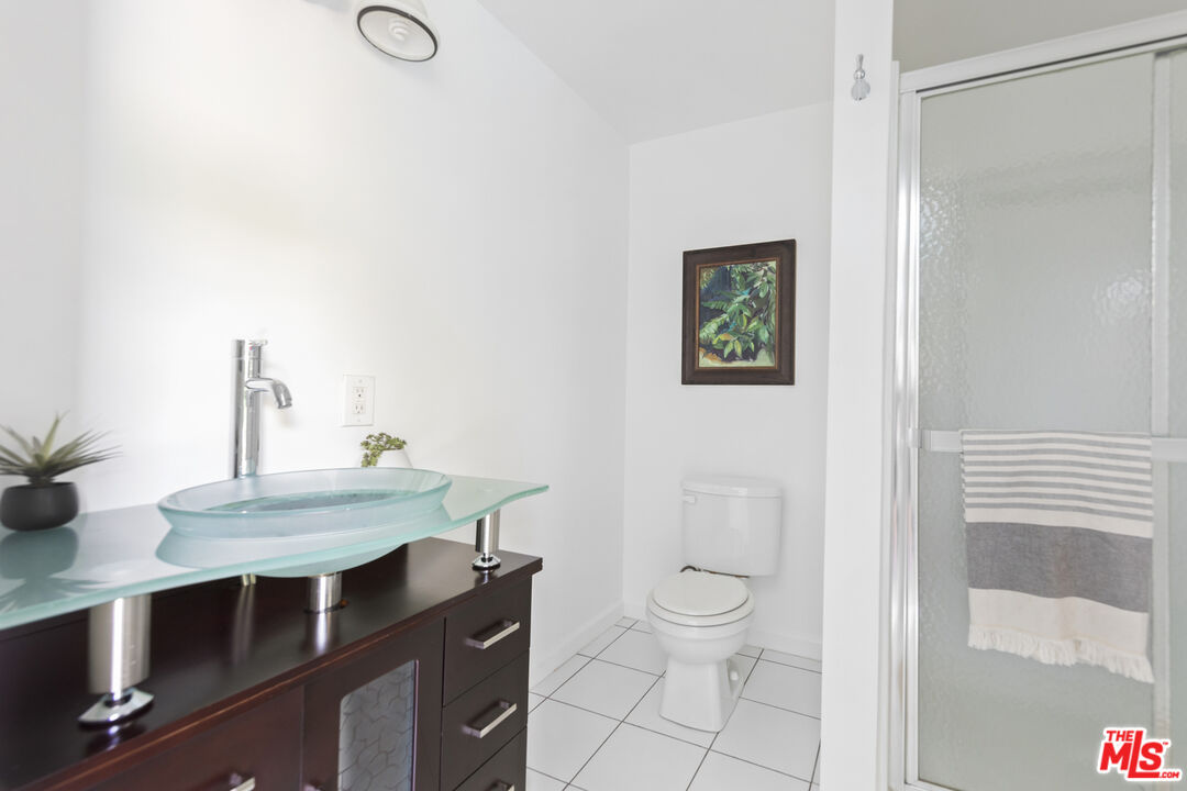 13604 Hart Street Van Nuys, CA 91405 - Photo 38 of 43 a bathroom with a sink a toilet and shower