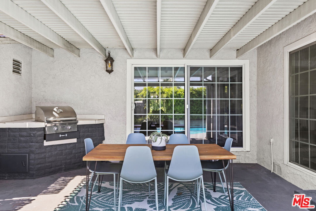 13604 Hart Street Van Nuys, CA 91405 - Photo 39 of 43 a view of a dining room with furniture window and wooden floor