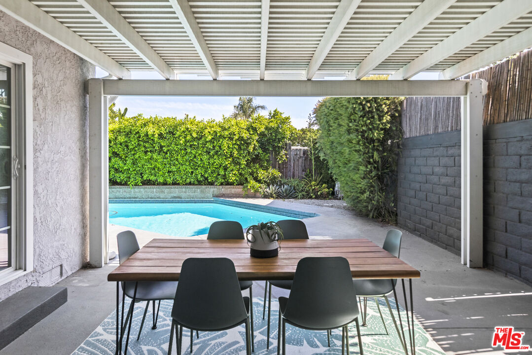 13604 Hart Street Van Nuys, CA 91405 - Photo 40 of 43 a view of a patio with table and chairs with plants