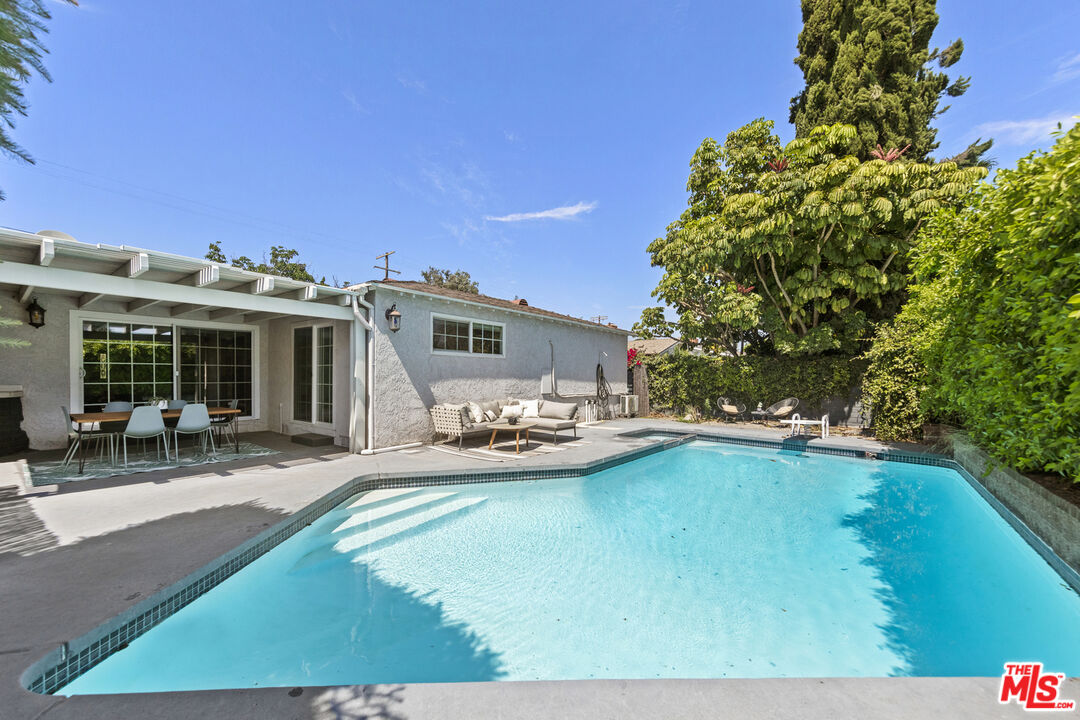 13604 Hart Street Van Nuys, CA 91405 - Photo 41 of 43 a view of a house with swimming pool and sitting area