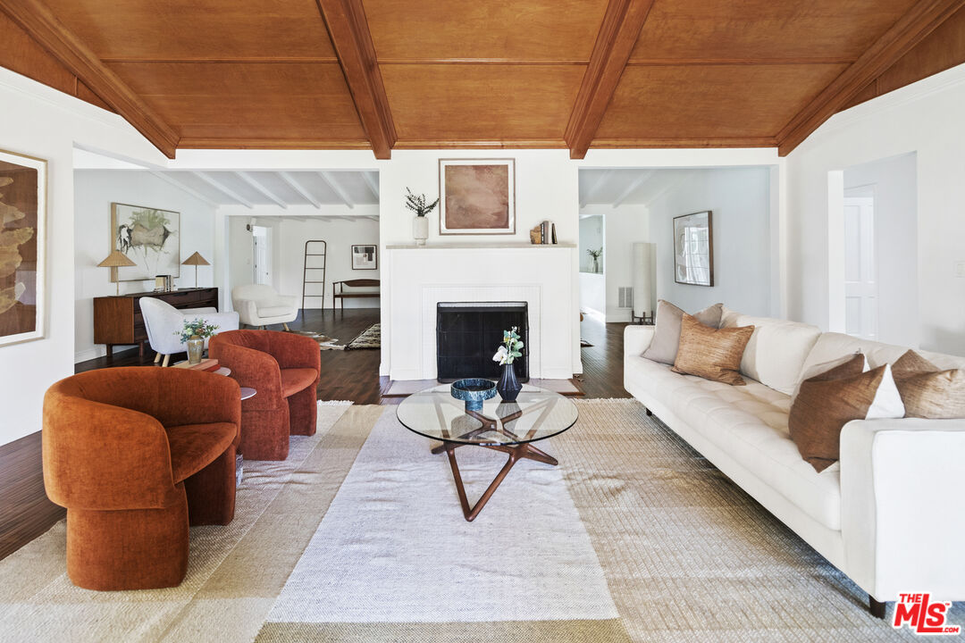13604 Hart Street Van Nuys, CA 91405 - Photo 6 of 43 a living room with furniture and a fireplace