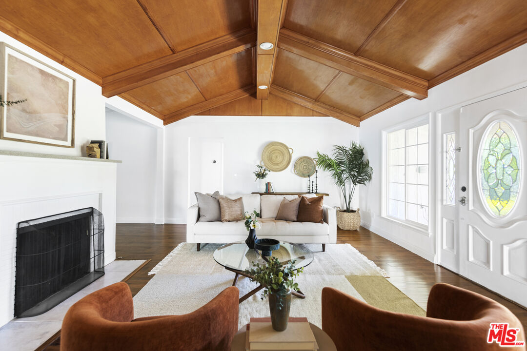13604 Hart Street Van Nuys, CA 91405 - Photo 7 of 43 a living room with furniture and a fireplace
