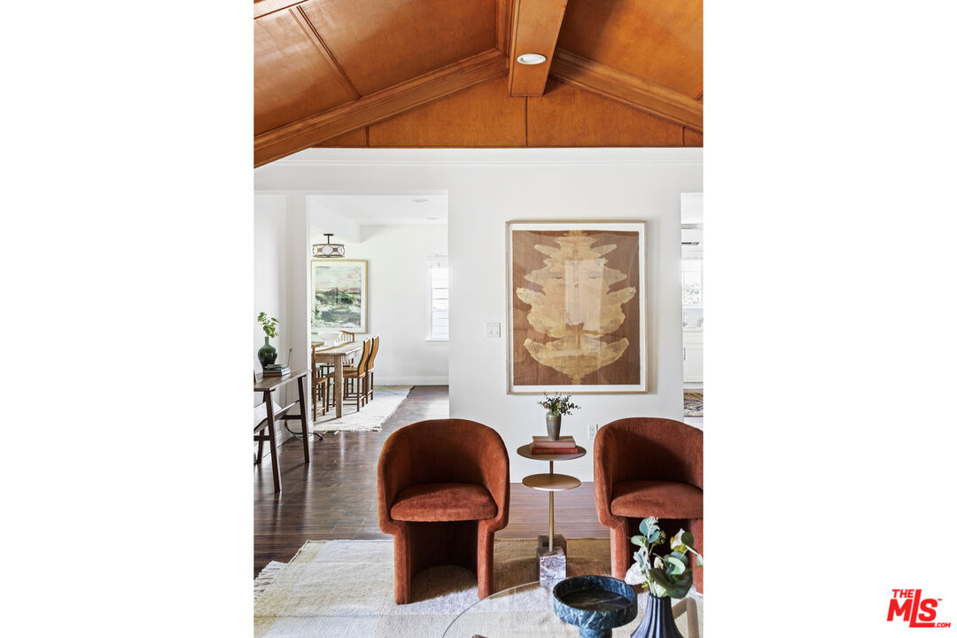 13604 Hart Street Van Nuys, CA 91405 - Photo 9 of 43 a picture of table and chair with wooden floor