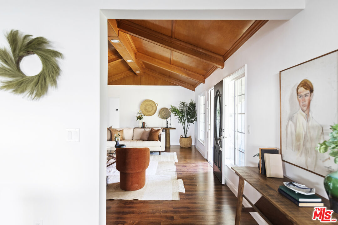 13604 Hart Street Van Nuys, CA 91405 - Photo 10 of 43 a living room with furniture and wooden floor