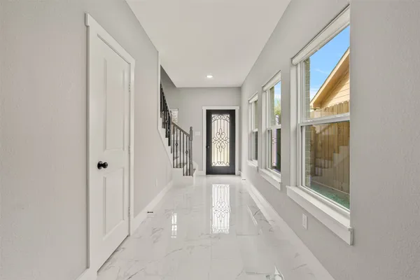 a view of a hallway with a white walls