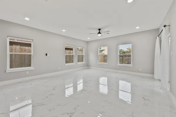 a view of an empty room with a window