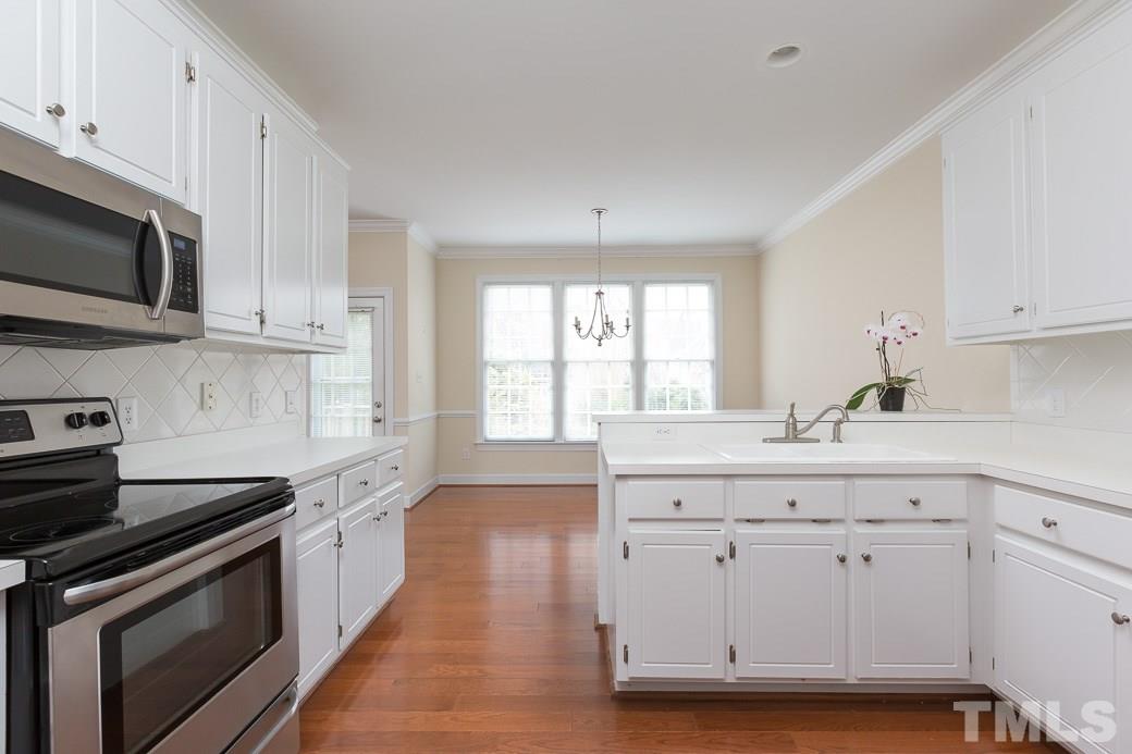 9116 Cub Trail Raleigh, NC 27615 - Photo 5 of 21 The kitchen has great stainless steel appliances and an eat-in bar.