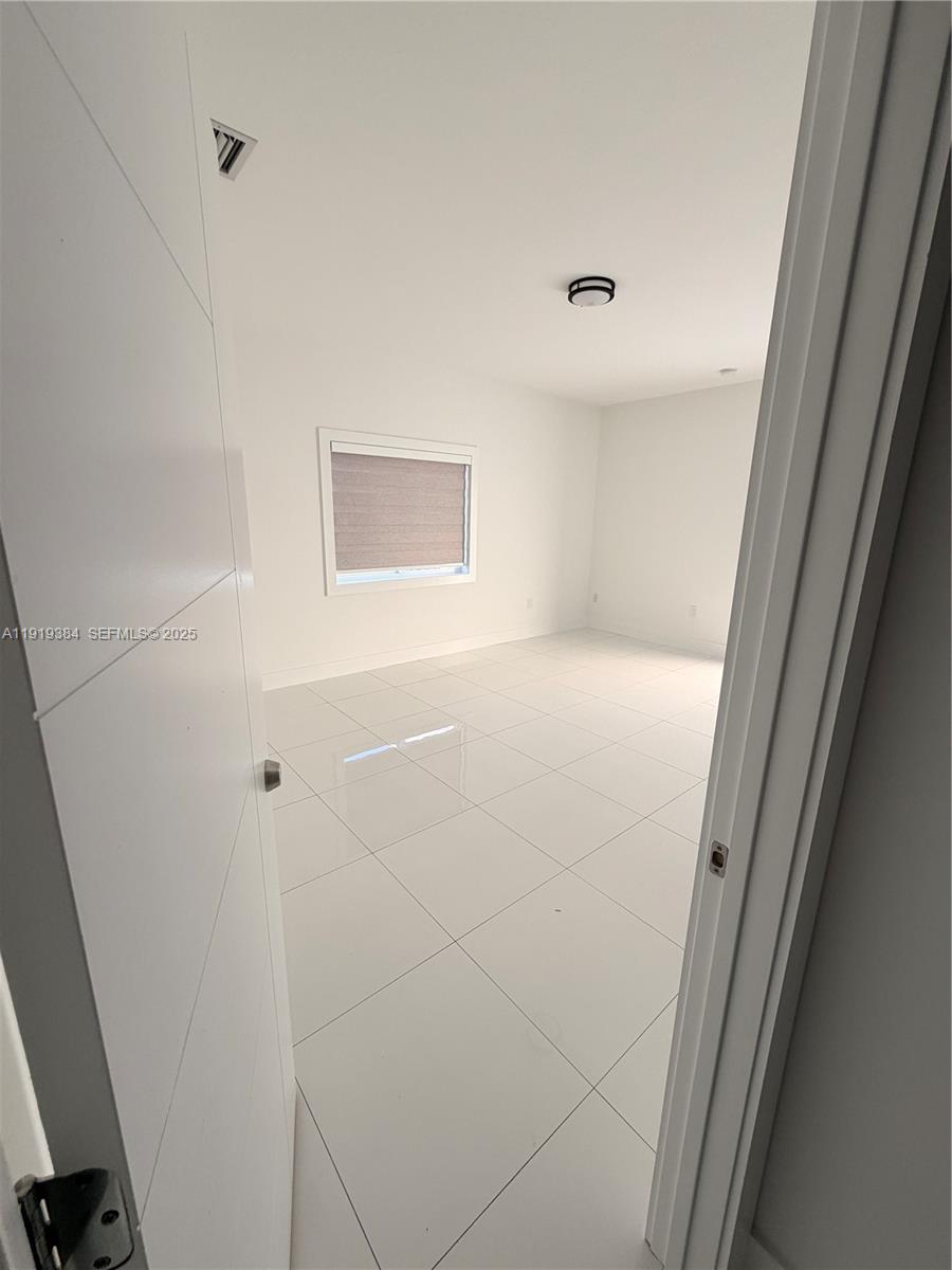 17334 Southwest 303rd Street Homestead, FL 33030 - Photo 14 of 34 a view of a hallway