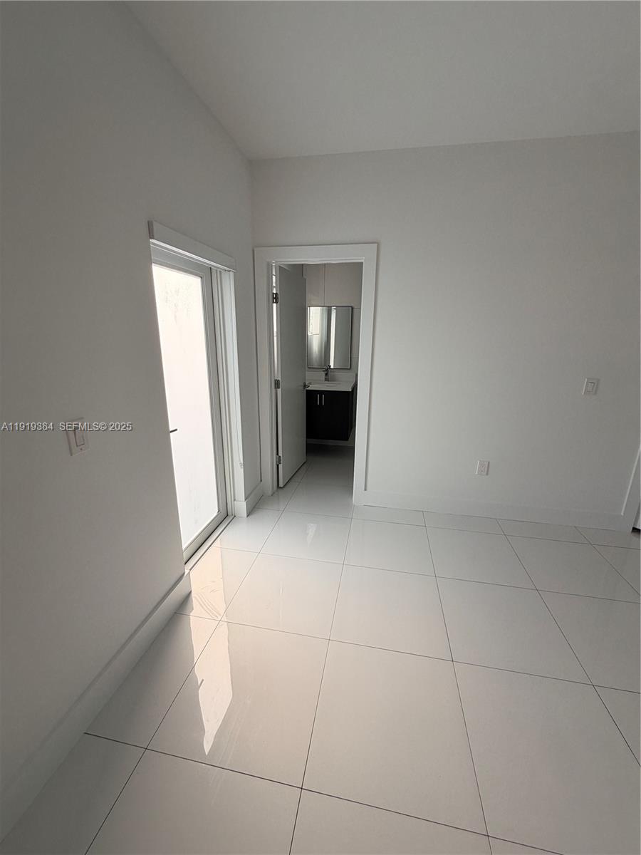 17334 Southwest 303rd Street Homestead, FL 33030 - Photo 15 of 34 a view of an empty room with a window